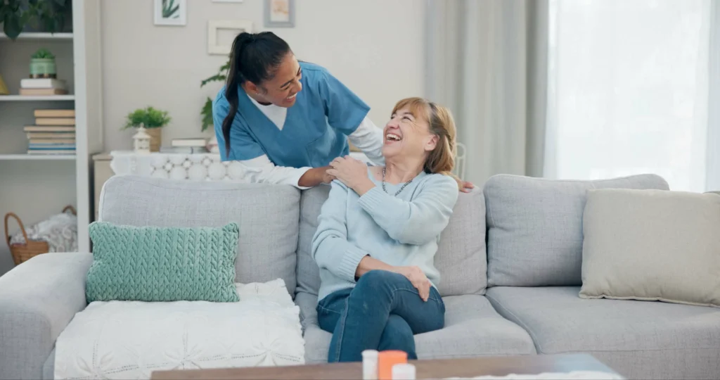 Compassionate home carer helping an older adult stay independent in their community